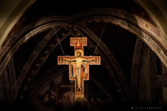 The San Damiano Cross is the large Romanesque rood cross that St. Francis of Assisi was praying before when he received the commission from the Lord to rebuild the Church. The original cross presently hangs in the Basilica of Saint Clare (Basilica di Sant